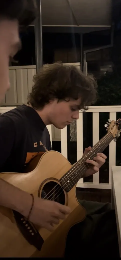 Ned plays guitar